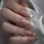 French tip nails with classic white tips and modern nail design details